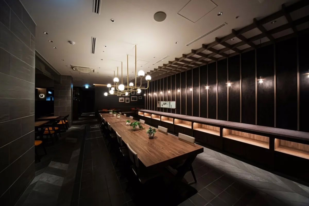 Modern café entrance with glass facade and greenery, inviting customers with vibrant menu displays and a contemporary design.